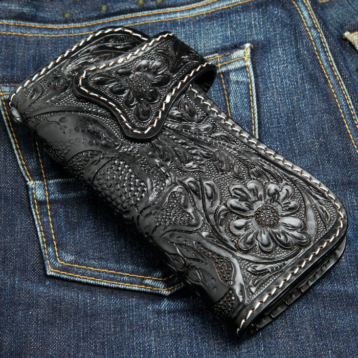 The back of the leather biker wallet, showing the intricate hand-carved floral pattern.