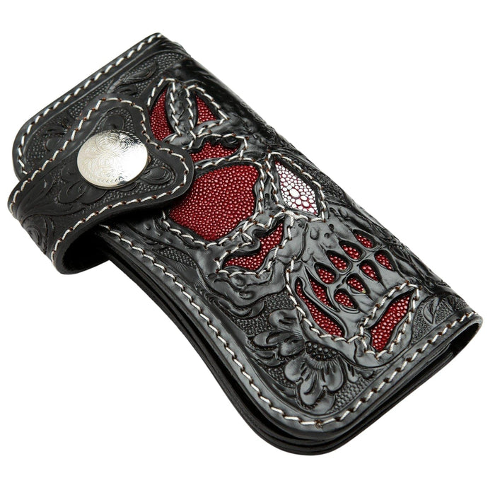 Angled view of the Phantom Skull biker wallet, showing the red stingray inlay and hand-carved leather.