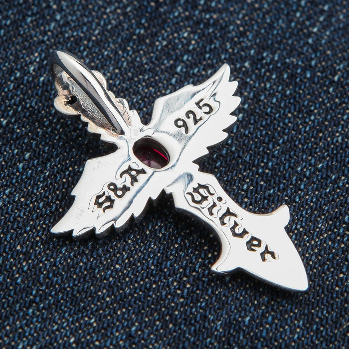The back of the angel wing cross pendant, showing the 'S&A Silver' and '925' hallmark engravings.