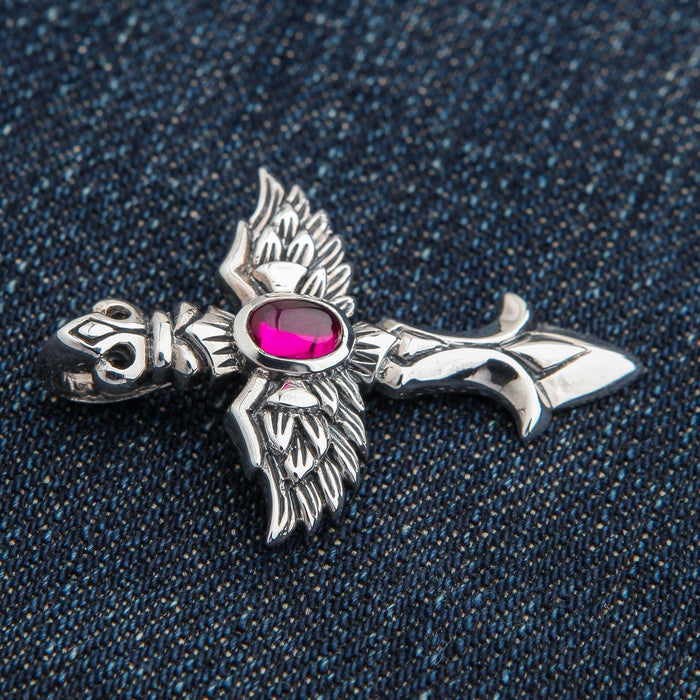 A side profile of the men's angel cross pendant, showing its three-dimensional depth.