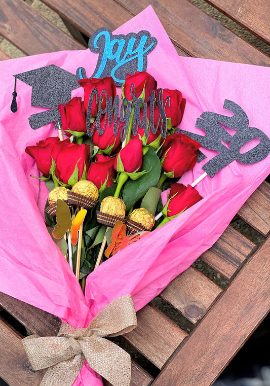 Red roses with graduation toppers