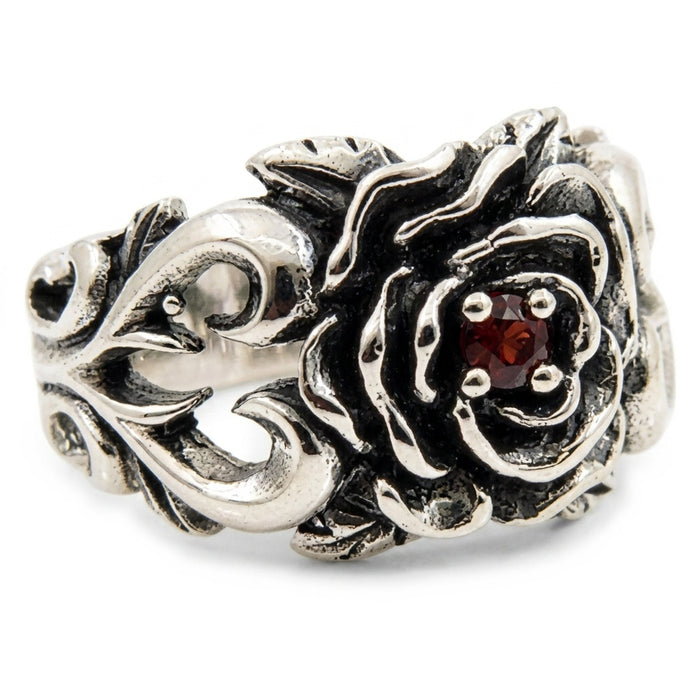 Three-quarter angle of gothic rose ring revealing ornate silver scrollwork and leaf detail on the band