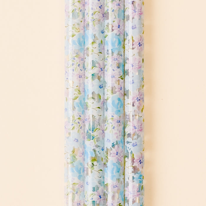 The Secret Garden Blue 40 oz Tumbler Straw Set by the-darling-effect features clear BPA-free reusable straws with a pastel blue and purple floral pattern—perfect for adding a touch of charm to your tumbler.