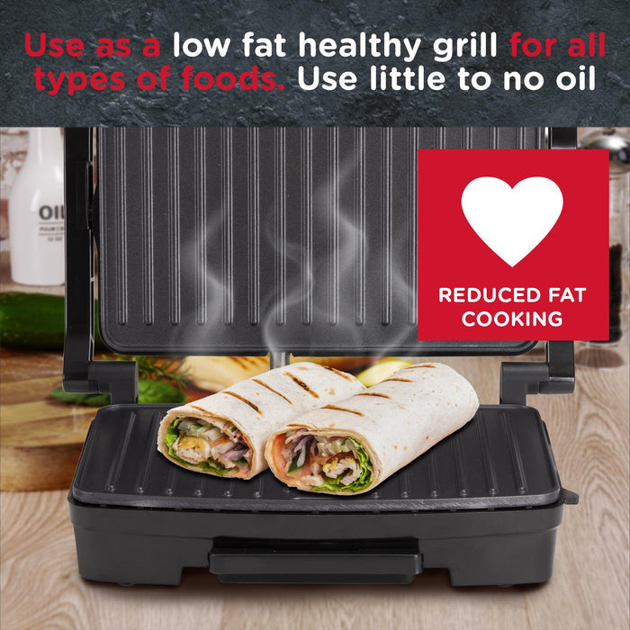 Black grill with a tortilla wrap on it, featuring text about low fat healthy cooking. - Buy Now Panini Press, Sandwich Toaster & Health Grill