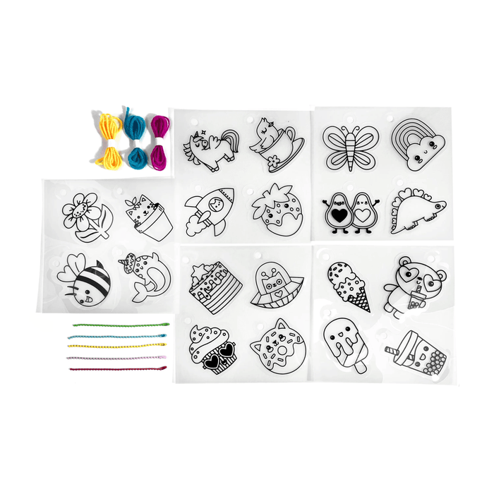 Contents of OOLY Shrink-its! DIY Shrink Art Kit - Cute Crew including shrink sheets, colored cords and colored ball chains