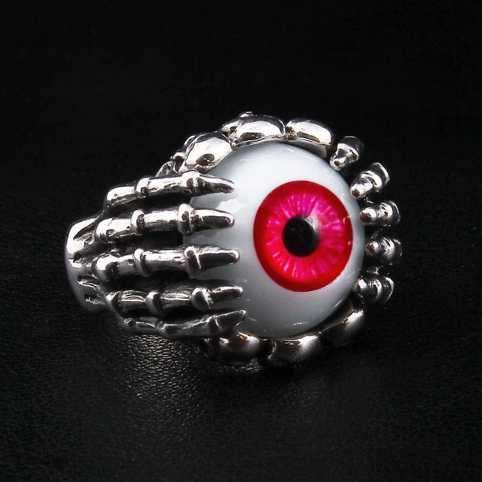 925 sterling silver skeleton claw ring with red evil eye center stone front view on black background