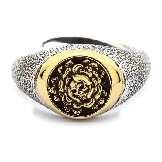Front view of .925 sterling silver skull and rose ring with gold brass signet face and stippled antiqued band