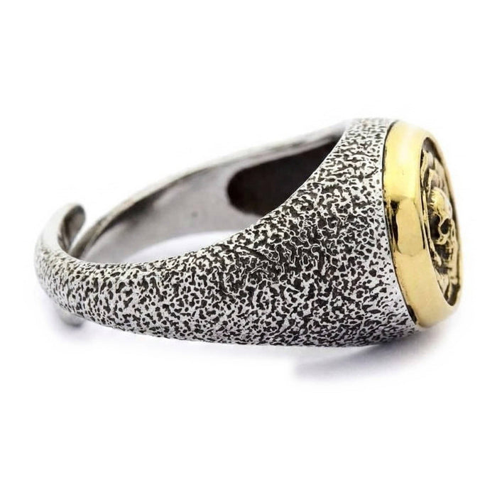 Side profile of the stippled sterling silver band and raised gold skull-in-rose signet on the skull and rose ring