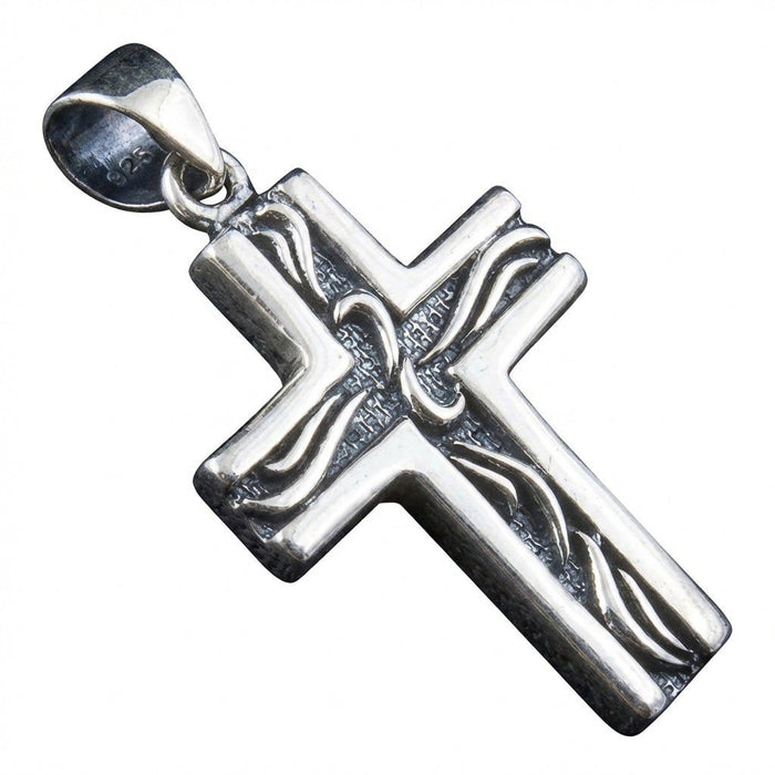 Angled close-up highlighting the 925 hallmark stamped inside the bail and raised tribal lines on the silver pendant.