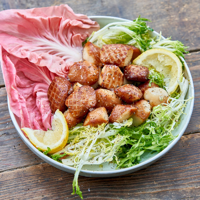 Smoked Weathervane Scallops on a bed of lettuce and lemons
