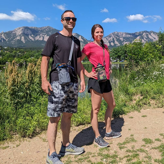 Hikers with water bottle slings.