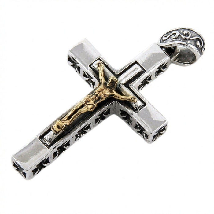 Side angle of two-tone sterling silver and gold crucifix pendant with ornate scrolled bail and Iron Cross edges