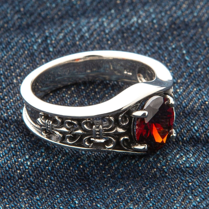 A medieval-style garnet ring for men, handcrafted from solid .925 sterling silver.