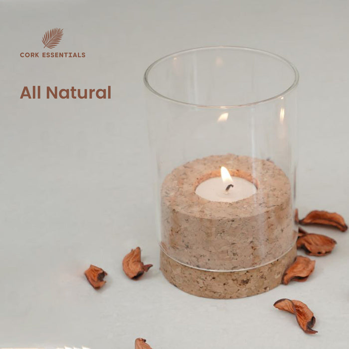Candle in a glass holder with cork base on a light gray background, featuring 'Cork Essentials' branding.