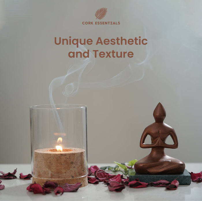 Cork candle and statue on a table with 'Cork Essentials' branding.
