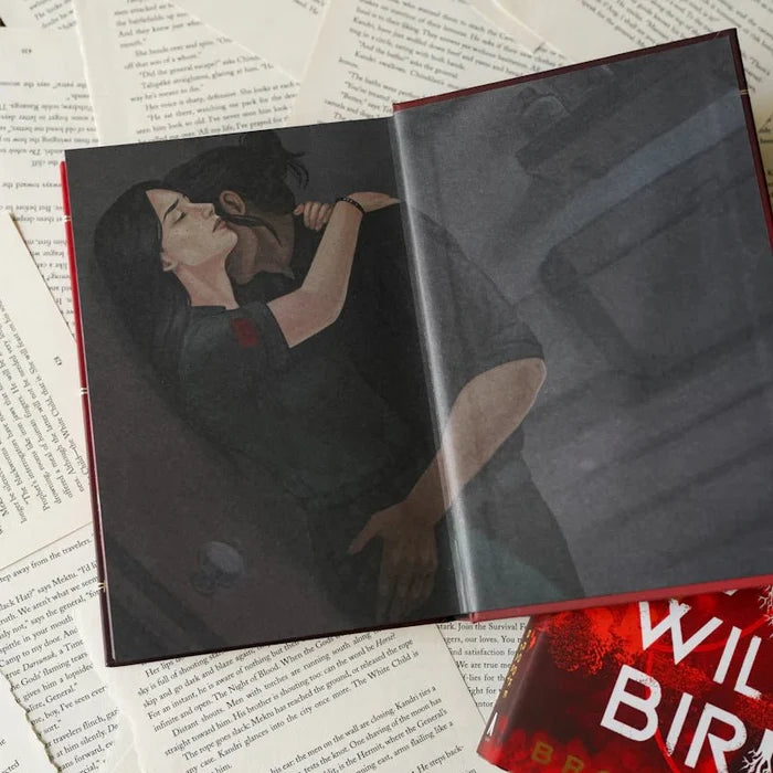 Open To Cage a Wild Bird LitJoy Edition displaying a full-color interior illustration of an intimate close-up between a dark-haired woman and man leaning toward each other in a dramatic moment, laid on scattered open book pages