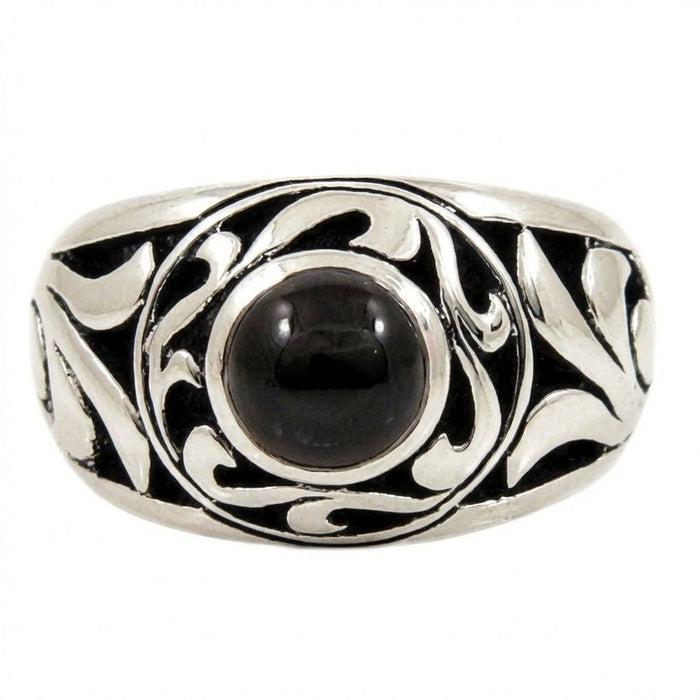 Front view of a sterling silver ring with a round cabochon black onyx set among raised, polished tribal swirls.