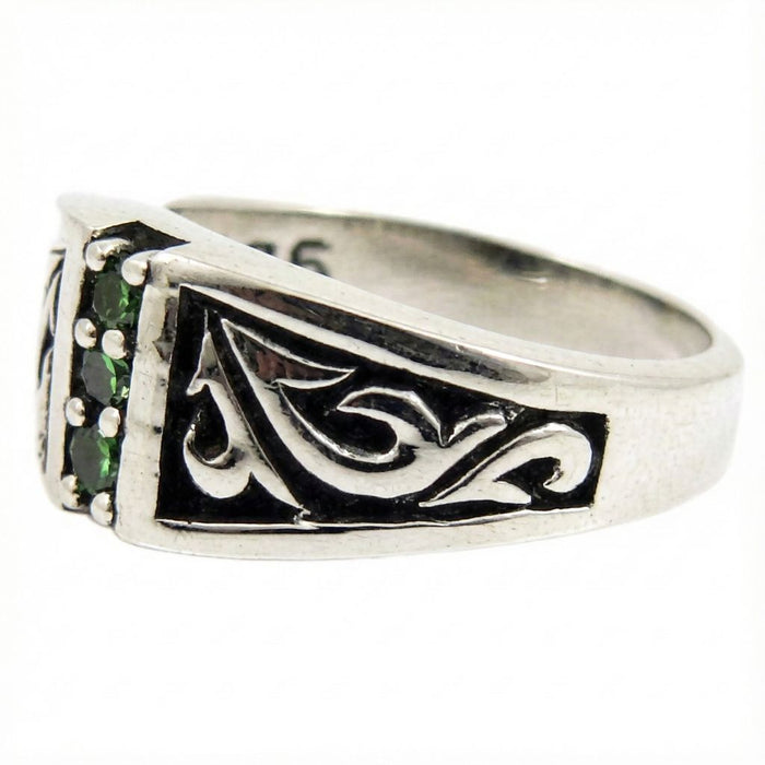 Side profile view of Tribal Emerald Sterling Silver Ring featuring intricate carved tribal scrollwork on the band and green emerald stone setting