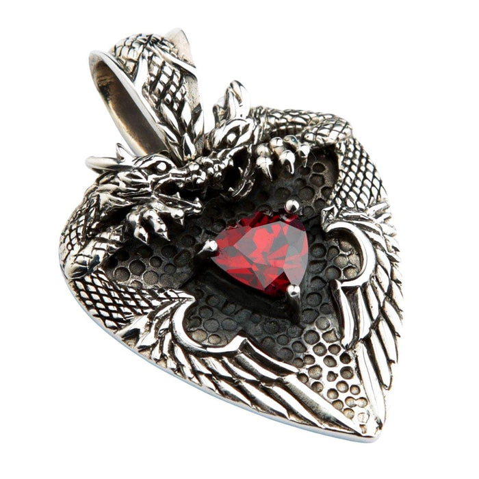 An angled view of the gothic dragon heart pendant, highlighting the detailed silver dragons and red garnet.