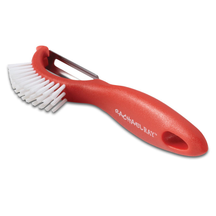 The Veg-A-Peel 3-in-1 Tool is an innovative kitchen gadget featuring a red cleaning brush and a convenient vegetable peeler attached to the handle, and it's also dishwasher safe.