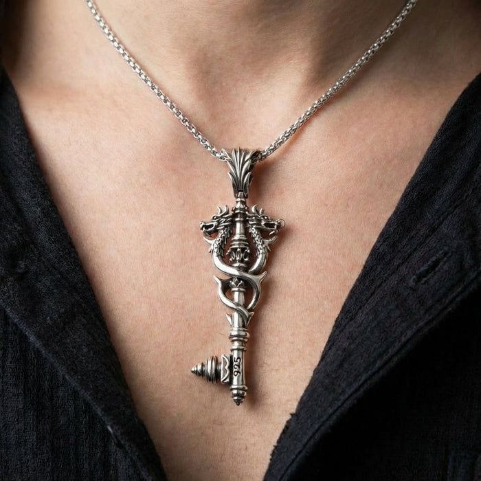 Viking double dragon sterling silver key pendant worn on silver chain necklace showing scale on model