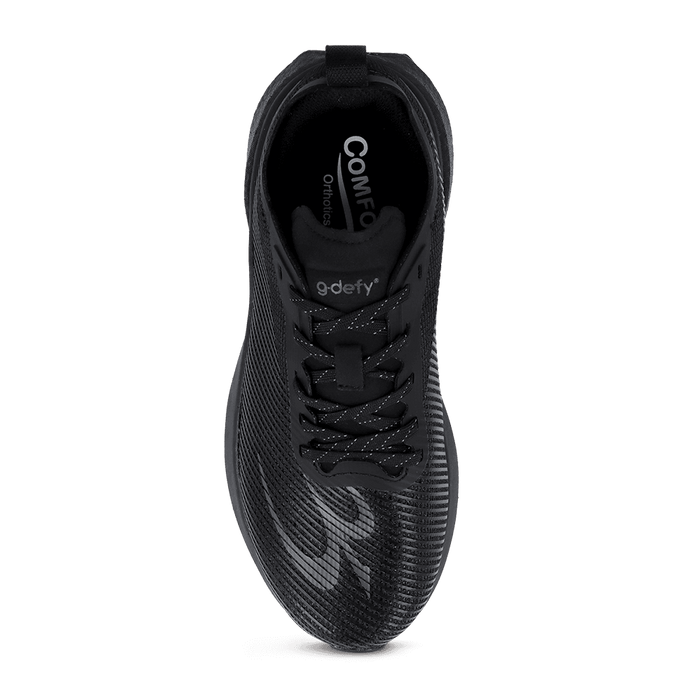 Black athletic shoe with textured mesh upper, reflective laces, and 'g-defy' branding, seen from a top-down view.
