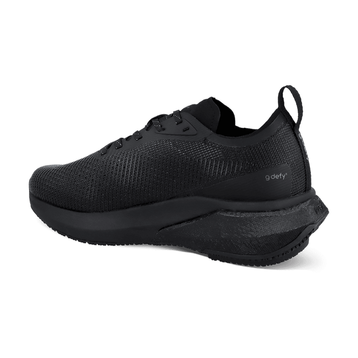 Black g-defy running shoe with a textured mesh upper and a sculpted sole, viewed from a back angle.