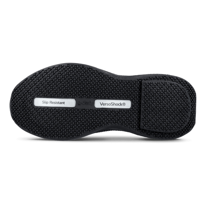 Black shoe sole with slip-resistant tread pattern, featuring VersoShock® technology and g-defy branding.
