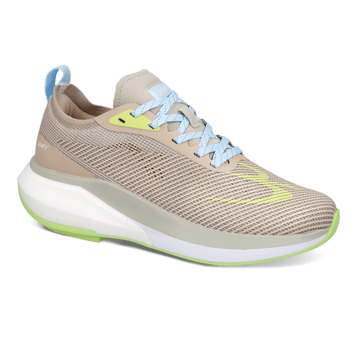 Beige mesh running shoe with light blue laces, lime green accents on the sole and logo, and a thick white midsole, shown at a