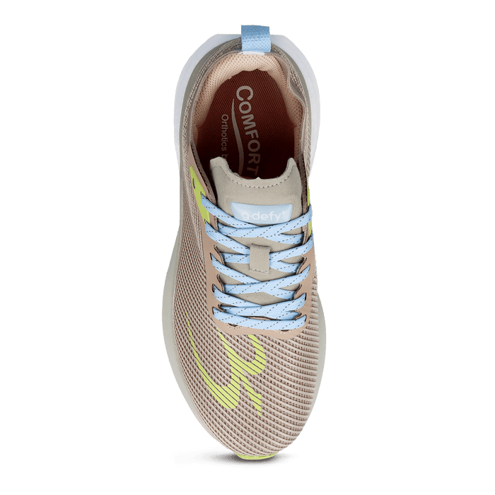 A-defy running shoe with beige mesh upper, light blue laces, light green side accents, and a white sole, viewed from above.