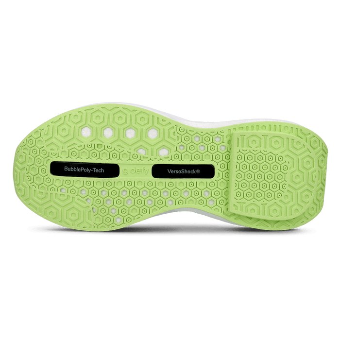 Lime green g-defy sneaker sole with hexagonal grip pattern, featuring BubblePoly-Tech and VersoShock® technologies.