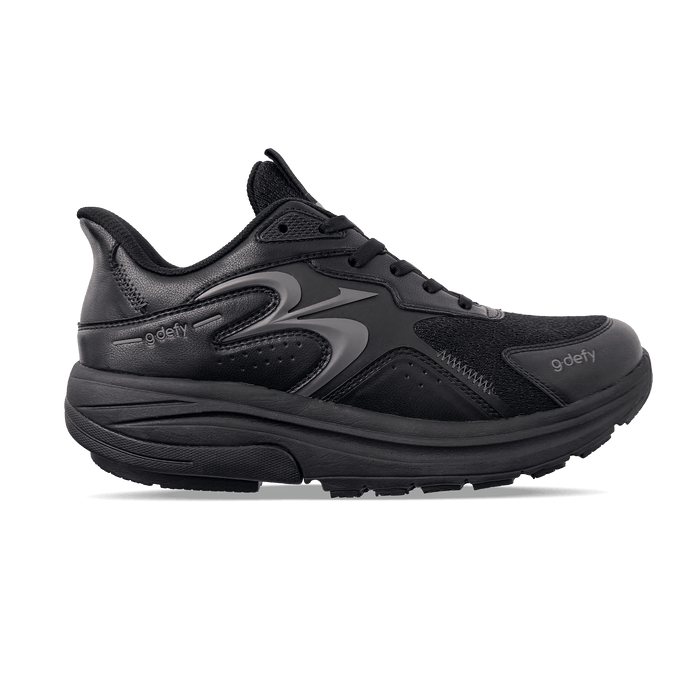 Black g-defy sneaker with a mesh upper, thick cushioned sole, and subtle grey logo detailing, viewed from the side.