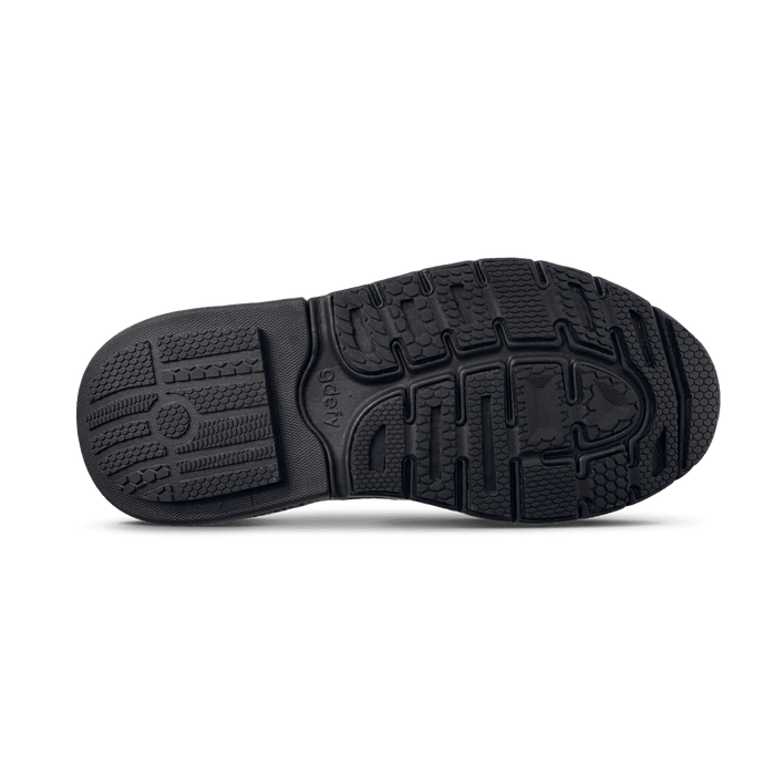Black shoe sole with textured tread pattern and "gdefy" logo visible on the arch.