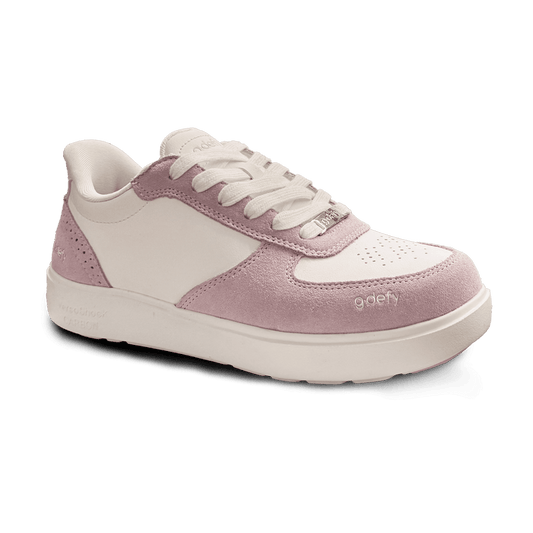 White and pink gdefy sneaker with white laces, leather upper, and pink suede accents. Features a thick sole with VersoShock C