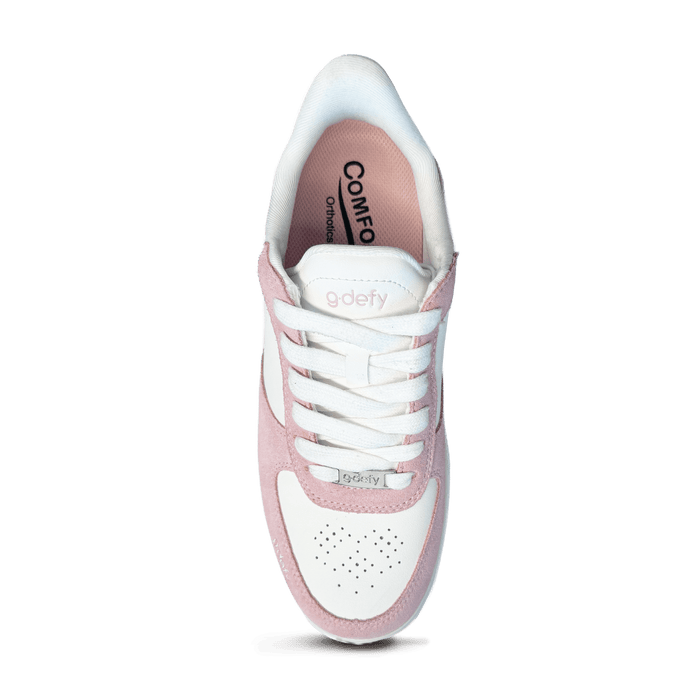 White and pink g-defy sneaker with white laces, pink suede accents, and perforated toe box, top view.