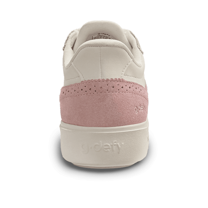 Back view of a cream and pink g-defy sneaker with a perforated suede heel panel and logo on the sole.