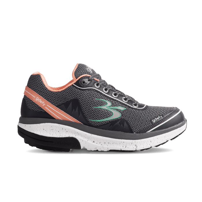 Dark gray mesh running shoe with peach accents and green logo, featuring a white speckled sole.