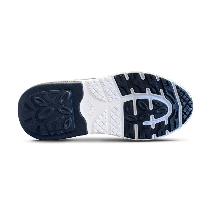 Shoe sole with black and white rubber traction. Features a gdefy logo, circular heel pattern, and geometric forefoot grip.