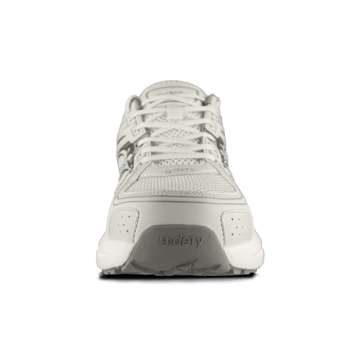 Front view of a white g-defy athletic shoe featuring a breathable mesh upper, synthetic details, and gray sole accents.