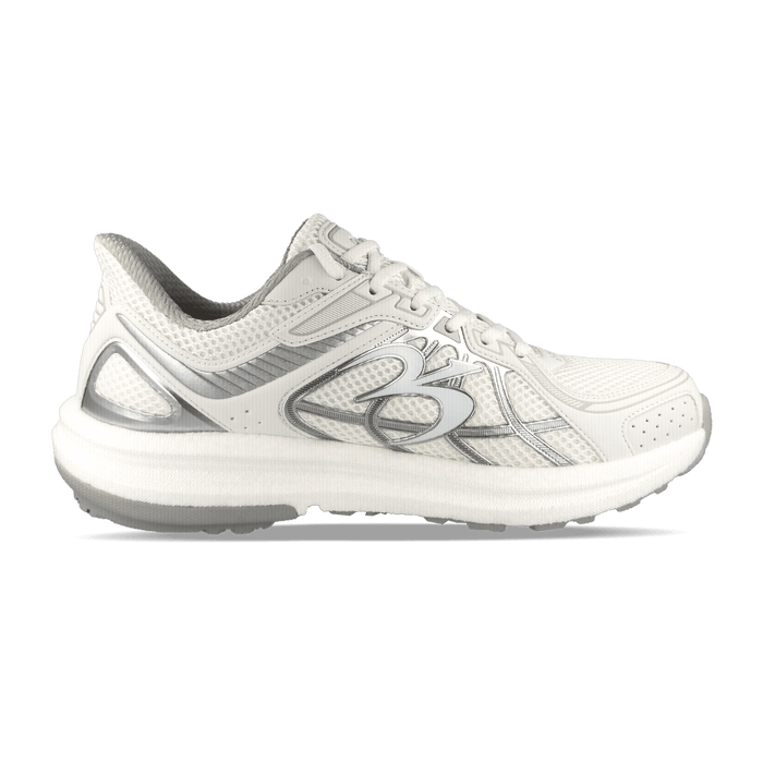 White athletic shoe with silver accents and mesh upper, featuring a thick white sole and light gray lining.