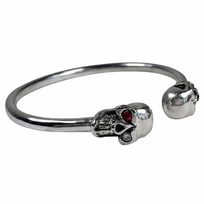 The adjustable twin skull bangle, displaying the open cuff design.