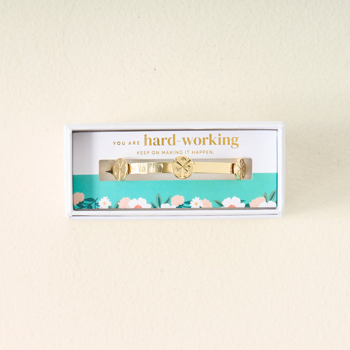 The Darling Effect’s You Are Hard-Working Skinny Stacker Bracelet comes gift-ready in a white floral box with the message, "You are hard-working. Keep on making it happen." A perfect jewelry gift for someone special.